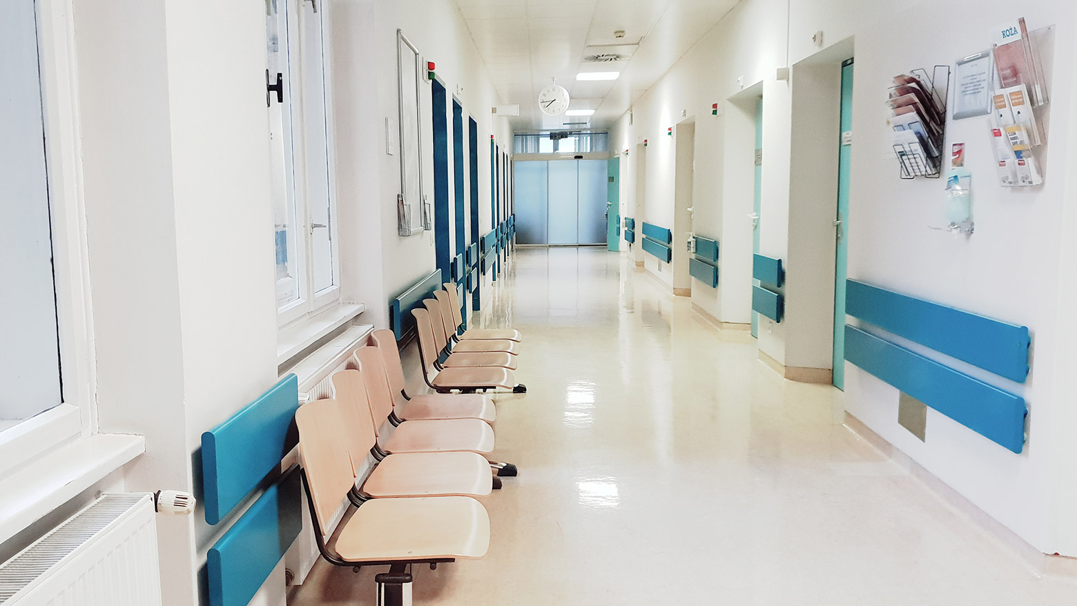 Doctor walks down the hallway of a hospital