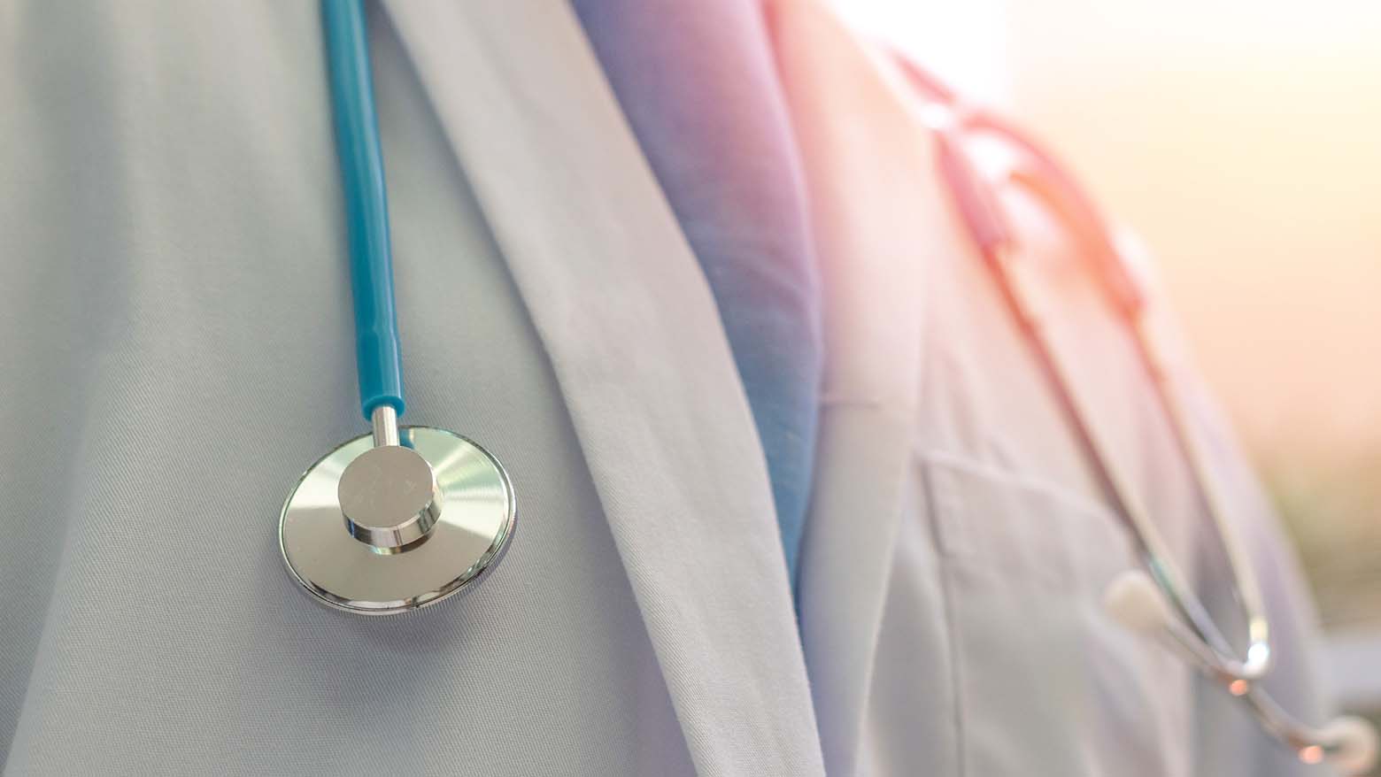Close up of a doctor wearing a medical coat and stethoscope
