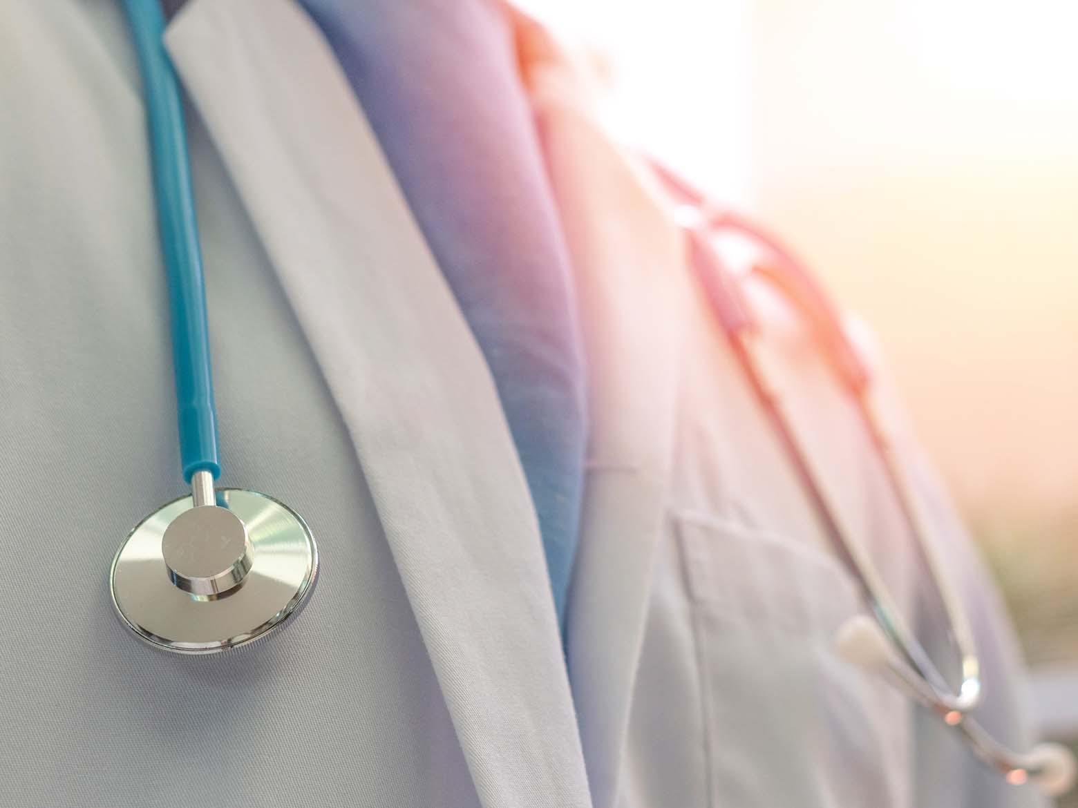 Close up of a doctor wearing a medical coat and stethoscope